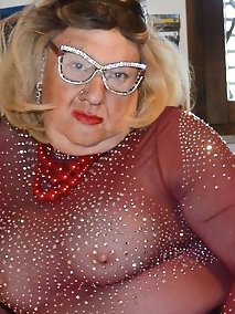 A submissive woman with large breasts engages in sexual activities.